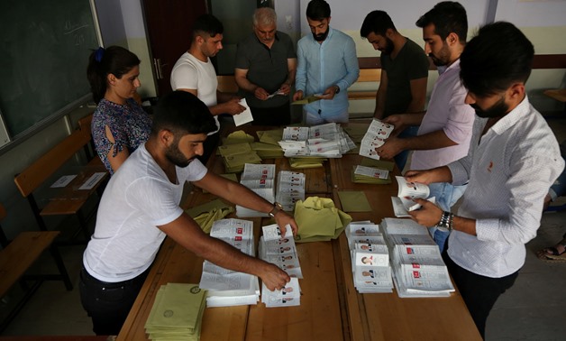 Ballots of Turkey's presidential and parliamentary elections are being counted at a polling station in Diyarbakir, Turkey June 24, 2018. REUTERS/Sertac Kayar