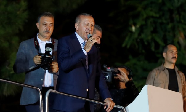Turkish President Tayyip Erdogan addresses his supporters in Istanbul, Turkey June 24, 2018. REUTERS/Osman Orsal
