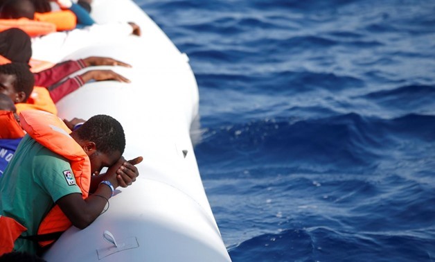Migrants are seen during rescue operation in the Mediterranean Sea October 20, 2016. YaraNardi/Italian Red Cross press office/Handout via Reuters
