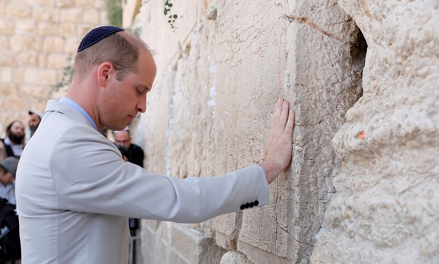 Britain's Prince William touches the Western Wall, Judaism's holiest prayer site, in Jerusalem's Old City, June 28, 2018. Abir Sultan/Pool via Reuters