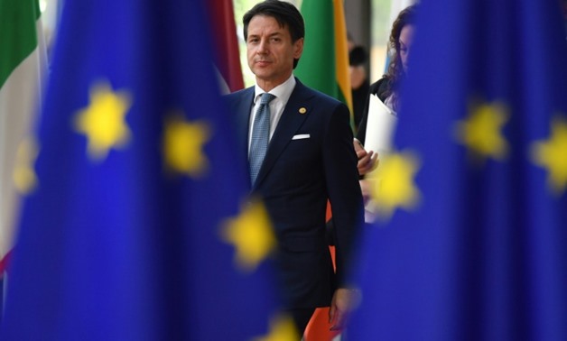 Italian Prime Minister Giuseppe Conte arrives at the EU summit threatening to block a joint statement on migration unless Italy gets more help
