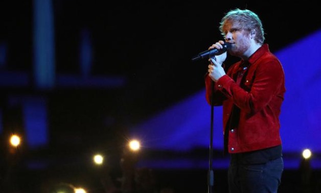 FILE PHOTO: Ed Sheeran performs at the Brit Awards at the O2 Arena in London, Britain, February 21, 2018. REUTERS/Hannah McKay/File Photo.