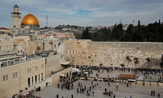 A general view shows the Western Wall (R) and the Dome of the Rock (L) in the Al-Aqsa mosque compound in the Old City of Jerusalem on December 5, 2017.