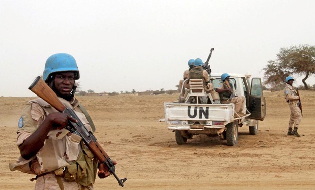 FILE PHOTO: UN peacekeepers stand guard in the northern town of Kouroume, Mali, May 13, 2015. Kourome is 18 km (11 miles) south of Timbuktu. REUTERS/Adama .