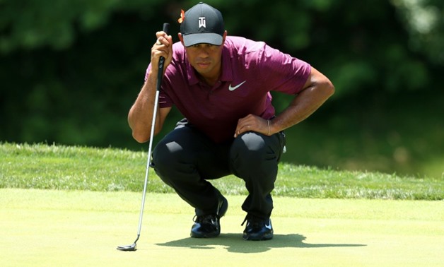 Tiger Woods lines up a putt on the ninth green during the second round of the Quicken Loans National at TPC Potomac on June 29, 2018 in Potomac, Maryland
Getty/AFP / Mike Lawrie

