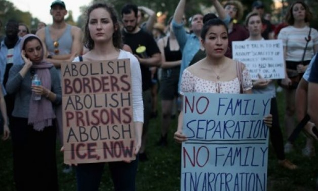 © GETTY IMAGES NORTH AMERICA/AFP/File | Demonstrators marched Friday in Chicago to protest Trump administration immigration policies at the start of a weekend expected to see scores of similar rallies across the country
