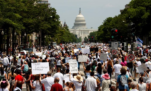 Immigration activists march toward the U.S. Capitol to protest the Trump Administration's immigration policy in Washington, U.S., June 30, 2018.
