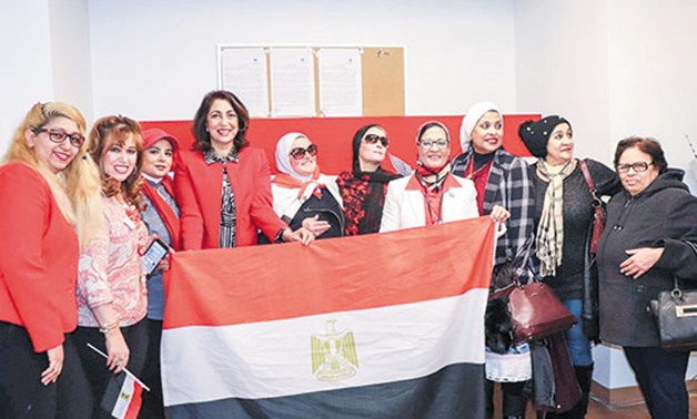 Egyptian ladies in Germany pose for the camera carrying thee Egyptian flag in celebration of June 30 revolution - Egypt today