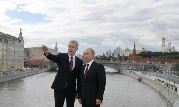 Moscow Mayor Sergei Sobyanin - here with Russian President Vladimir Putin (R) - will face no major opposition figure when he runs for reelection in September 2018
