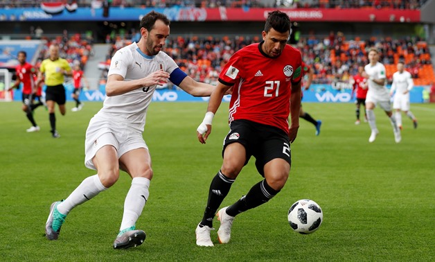 Soccer Football - World Cup - Group A - Egypt vs Uruguay - Ekaterinburg Arena, Yekaterinburg, Russia - June 15, 2018 Egypt's Trezeguet in action with Uruguay's Diego Godin REUTERS/Andrew Couldridge