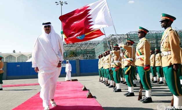 Qatari Emir Sheikh Tamim bin Hamad al-Thani inspects a guard of honor upon arriving - FILE 
