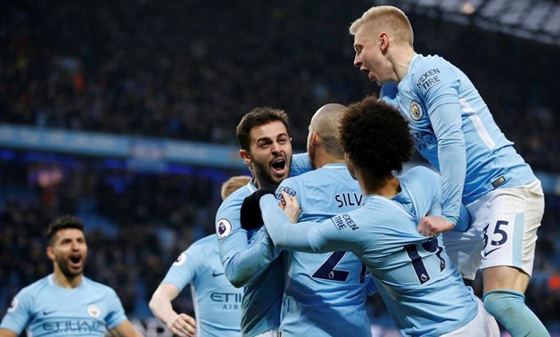 Man City Players celebrating scoring a goal, Reuters-Andrew Yates