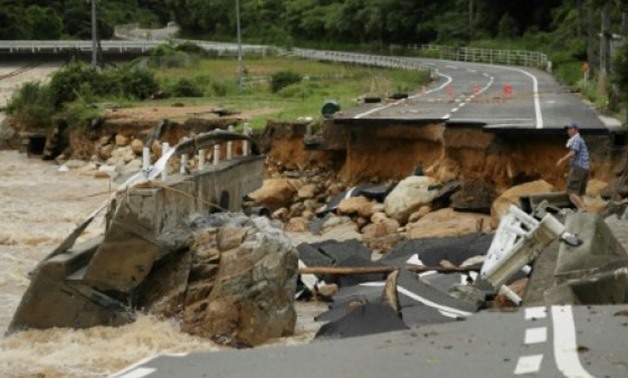 © JIJI PRESS/AFP | Intense rainfall triggered huge landslides and flash floods in Hiroshima, Okayama, Kyoto and other regions