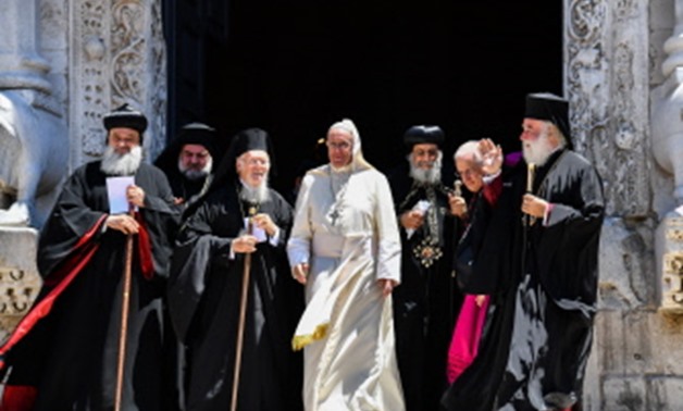  Bari, Apulia, Italy : Pope Francis (C) arrives to deliver his speech next to Ecumenic Patriarch of the Orthodox Church Bartolomeo I (C-L), Egypt's Coptic Orthodox Pope Tawadros (Theodoros) II (C-R) and other religious leaders after their meeting at the P