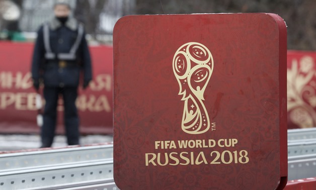 FILE PHOTO: A sign with the logo of the 2018 FIFA World Cup Russia is on display near the Kremlin before the events, dedicated to the upcoming World Cup Final Draw, in central Moscow, Russia November 29, 2017. REUTERS/Sergei Karpukhin/File Photo
