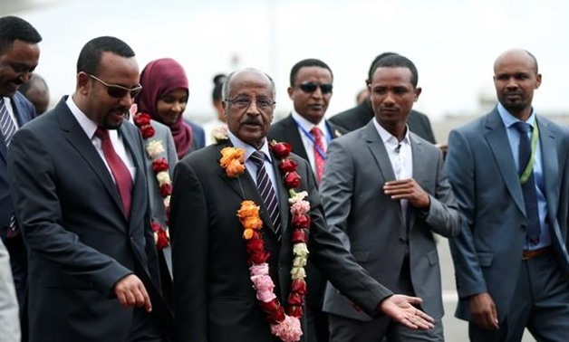 Ethiopia's Prime Minister Abiy Ahmed welcomes Eritrean Foreign Minister Osman Saleh and his delegation at the Bole International Airport in Addis Ababa, Ethiopia June 26, 2018. REUTERS/Tiksa Negeri
