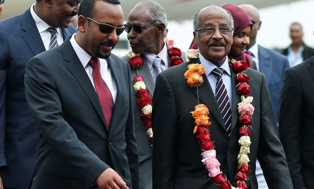 Ethiopia's Prime Minister Abiy Ahmed welcomes Eritrean Foreign Minister Osman Saleh at the Bole International Airport in Addis Ababa, Ethiopia, June 26 2018. Picture: REUTERS/ TIKSA NEGERI