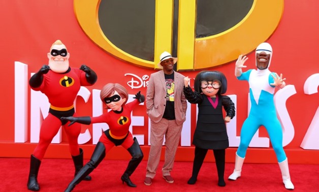 Actor Samuel L Jackson poses for photographs with characters from the flm as he arrives at the UK premiere of Incredibles 2 in London, Britain July 8, 2018. REUTERS/Simon Dawson
