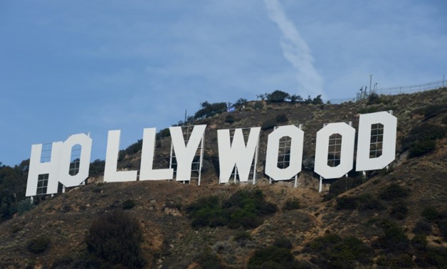 Warner Bros. said a proposed cable car would spare homeowners the annoyance of hikers and traffic coming past their front doors to view the landmark "Hollywood" sign-AFP/File / ROBYN BECK

