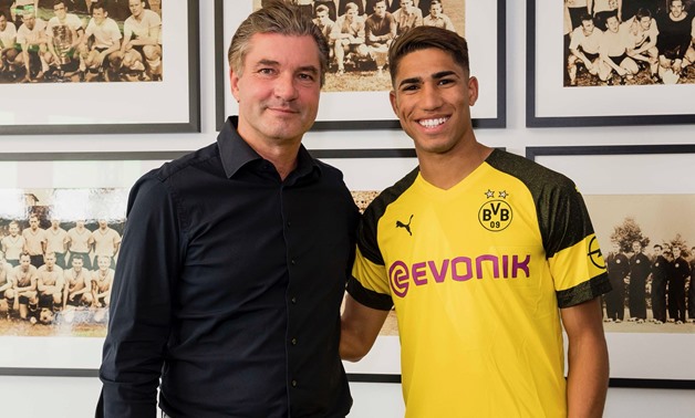 Achraf Hakimi with Borussia Dortmund jersey - Press image courtesy of Borussia Dortmund's official Twitter account