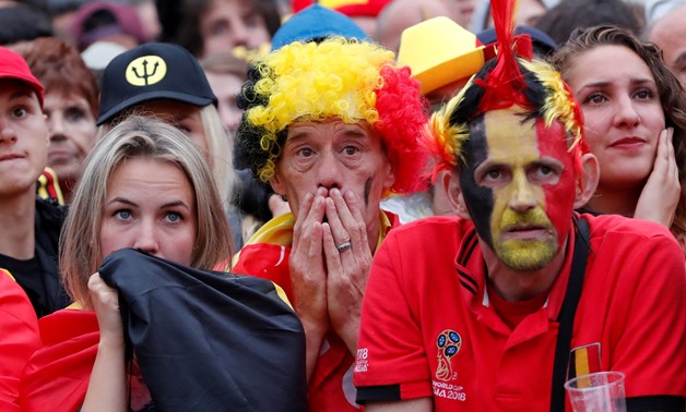 Soccer Football - World Cup - Semi-Final - France v Belgium - Brussels, Belgium - July 10, 2018. Belgium fans react as they watch the broadcast of the World Cup semi-final match between France and Belgium in the fan zone. REUTERS/Yves Herman TPX IMAGES OF