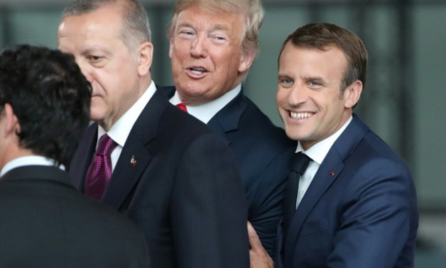 Emmanuel Macron and Donald Trump appeared to make jokes with each other at the NATO summit
