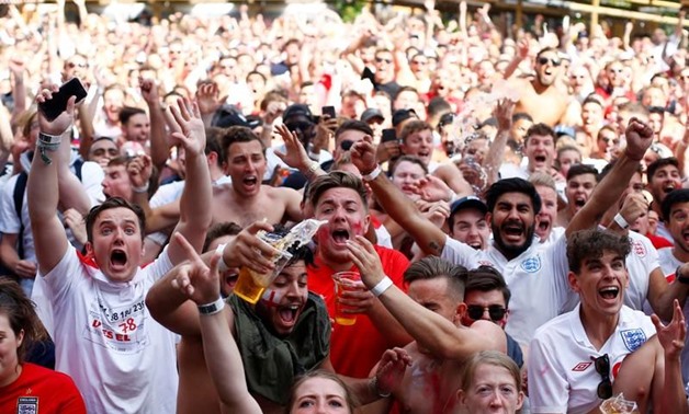 England fans celebrate their second goal. REUTERS/Henry Nicholls
