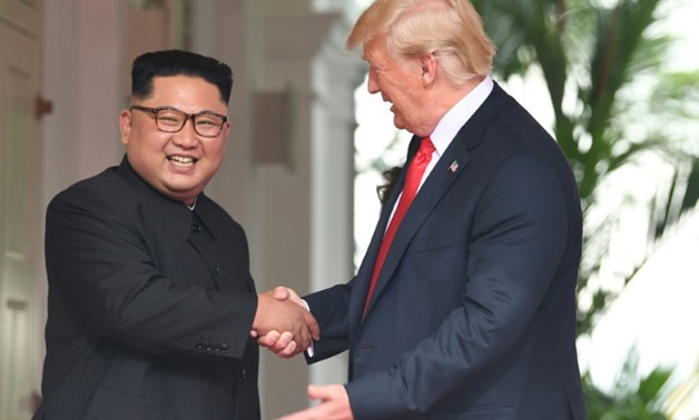 North Korean leader Kim Jong Un and President Donald Trump at the start of their historic summit last month
