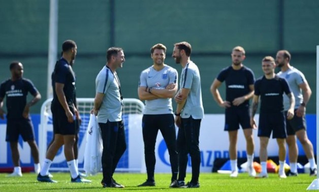 Soccer Football - World Cup - England Training - England Training Camp, Saint Petersburg, Russia - July 13, 2018 England manager Gareth Southgate, assistant manager Steve Holland and striker coach Allan Russell during training REUTERS/Dylan Martinez
