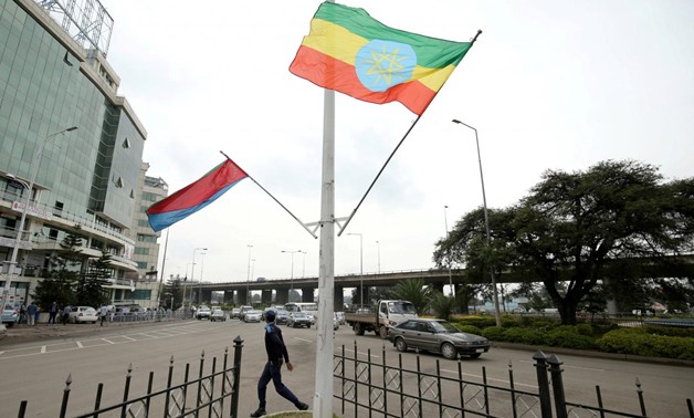 FILE PHOTO: A police officer walks past the flags of Ethiopia and Eritrea ahead of Eritrea's President Isaias Afwerki's visit to Addis Ababa, Ethiopia July 13, 2018. REUTERS/Tiksa Negeri/File Photo
