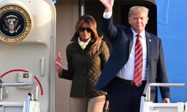 © AFP | Donald and Melania Trump landed in Scotland on Friday evening