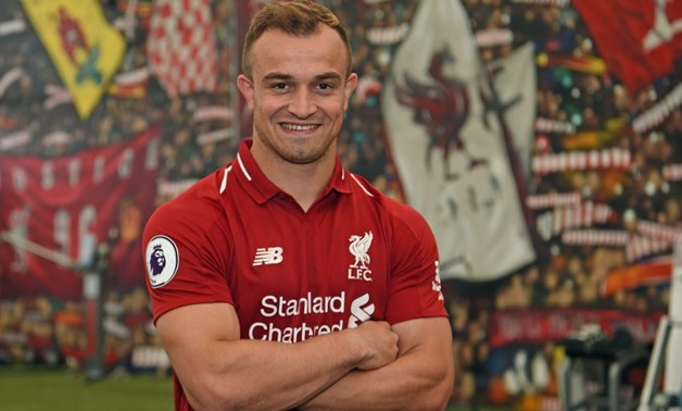 Shaqiri with Liverpool's jersey - Courtesy of Liverpool official website
