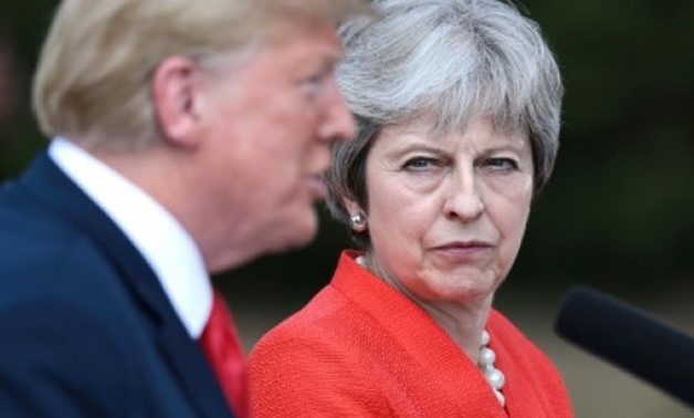 Britain's Prime Minister Theresa May has revealed that US President Donald Trump urged her to sue the European Union - POOL/Getty Images/File
