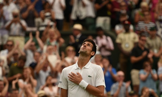 I'm back: Novak Djokovic reacts after beating Rafael Nadal in their epic semi-final
AFP / Oli SCARFF
