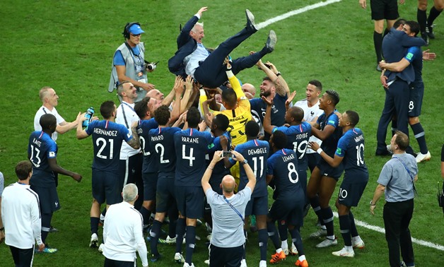 Soccer Football - World Cup - Final - France v Croatia - Luzhniki Stadium, Moscow, Russia - July 15, 2018 France coach Didier Deschamps is thrown up by the players to celebrate winning the World Cup REUTERS/Michael Dalder