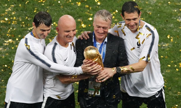 Soccer Football - World Cup - Final - France v Croatia - Luzhniki Stadium, Moscow, Russia - July 15, 2018 France coach Didier Deschamps with trophy as they celebrate winning the World Cup REUTERS/Christian Hartmann
