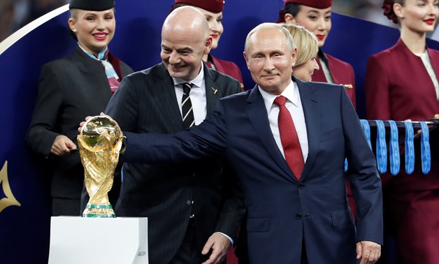 July 15, 2018 FIFA president Gianni Infantino and President of Russia Vladimir Putin with the World Cup trophy before the medals ceremony REUTERS/Damir Sagolj