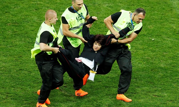 Soccer Football - World Cup - Final - France v Croatia - Luzhniki Stadium, Moscow, Russia - July 15, 2018 Stewards apprehend a pitch invader REUTERS/Maxim Shemetov TPX IMAGES OF THE DAY SEARCH "FIFA BEST" FOR ALL PICTURES.