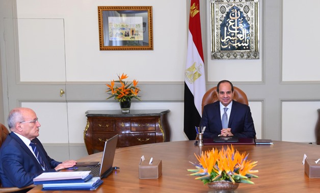 President Abdel Fatah al-Sisi (R) meets with Minister of State for Military Production, Dr. Mohamed El Assar. (L)- press photo