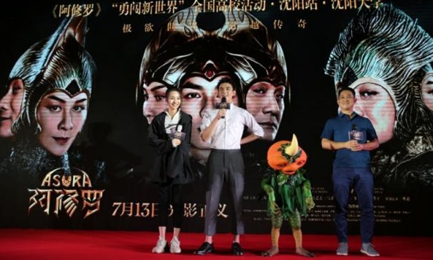 Director Zhang Peng (R) and actors Wu Lei (2nd L) and Zhang Yishang attend a promotional event for the movie "Asura" in Shenyang, Liaoning province, China July 2, 2018. REUTERS/Stringer.