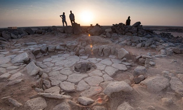 A stone structure at an archeological site containing a fireplace, seen in the middle, where charred remains of 14,500-year-old bread was found in the Black Desert, in northeastern Jordan in this photo provided July 16, 2018. Alexis Pantos/Handout via REU