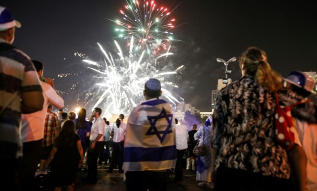 Israelis watch fireworks over Jerusalem on April 18, 2018, at the start of the country's 70th annual Independence Day celebrations
