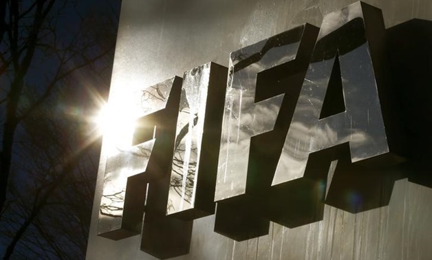 The sun is reflected in FIFA's logo in front of FIFA's headquarters in Zurich, Switzerland November 19, 2015. REUTERS/Arnd Wiegmann 