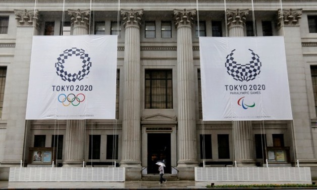 FILE PHOTO: Logos of Tokyo 2020 Olympics and Paralympics are seen on the Mitsui Main Building in Tokyo Japan, September 20, 2016. REUTERS/Toru Hanai/File Photo
