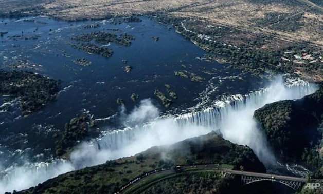 An aerial view of the Victoria Falls on the Zambezi River at the border between Zambia and Zimbabwe. Tourism accounts for around 10 percent of Zimbabwe's GDP. (Photo: AFP/Zinyange Auntony)