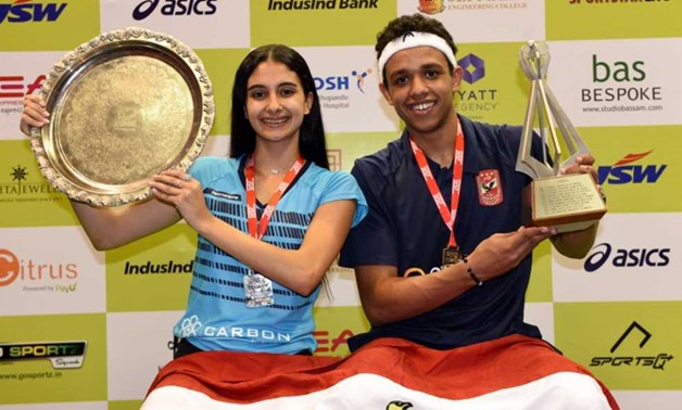 FILE - Asal and Rawan celebrating their titles