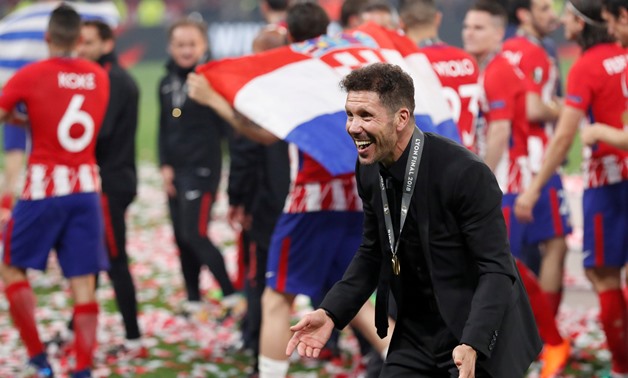 FILE PHOTO: Soccer Football - Europa League Final - Olympique de Marseille vs Atletico Madrid - Groupama Stadium, Lyon, France - May 16, 2018 Atletico Madrid coach Diego Simeone with his medal as he celebrates winning the Europa league REUTERS/Peter Czibo