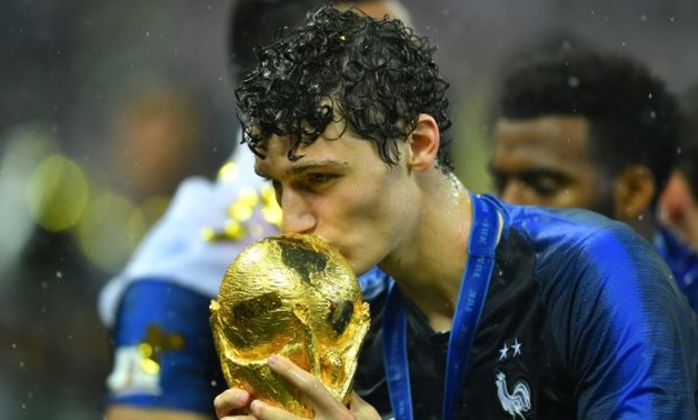 Soccer Football - World Cup - Final - France v Croatia - Luzhniki Stadium, Moscow, Russia - July 15, 2018 France's Benjamin Pavard kisses the trophy as he celebrates winning the World Cup REUTERS/Dylan Martinez
