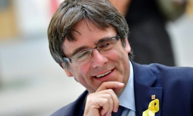 © AFP/File | Catalonia's deposed president Carles Puigdemont will return to Belgium on Saturday