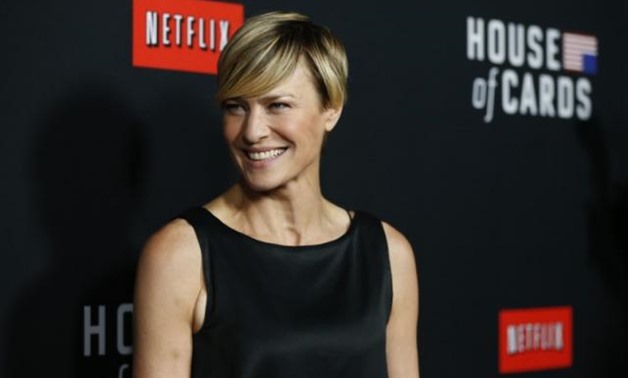 Cast member Robin Wright poses at the premiere for the second season of the television series "House of Cards" at the Directors Guild of America in Los Angeles, California February 13, 2014. Season 2 premieres on Netflix on February 14. REUTERS/Mario Anzu